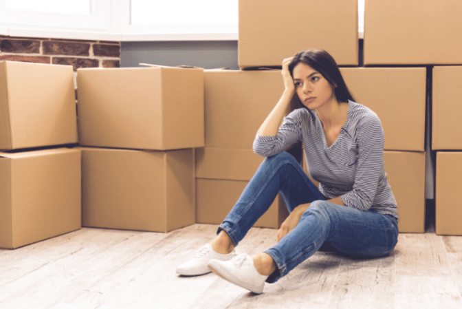 Hoarding 3 Years From Now Woman With Boxes in Room