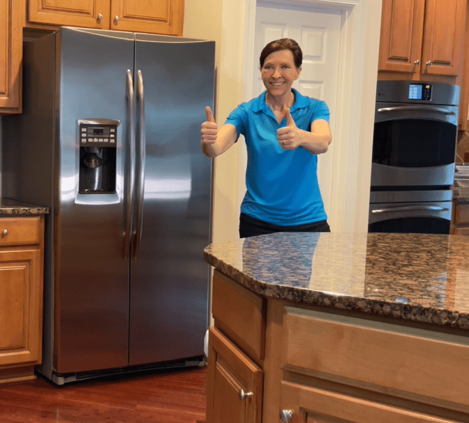 Who Moved My Dishwasher Angela Brown Thumbs Up at Refrigerator